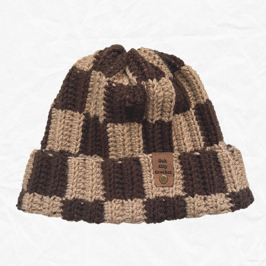 tan and brown checkered beanie on a white background